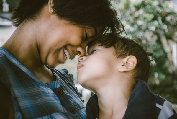 selective focus photography of woman and boy